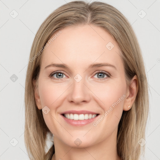 Joyful white young-adult female with long  brown hair and grey eyes