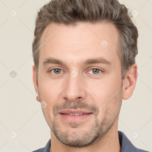 Joyful white adult male with short  brown hair and grey eyes