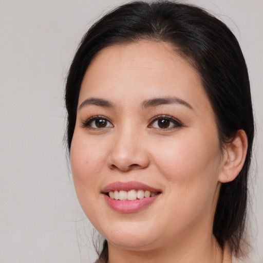 Joyful white young-adult female with medium  brown hair and brown eyes