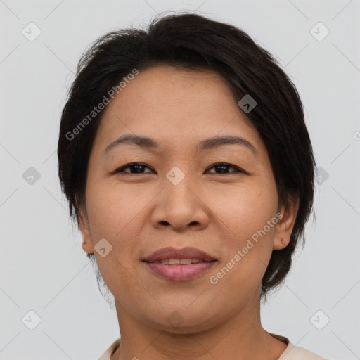 Joyful asian adult female with medium  brown hair and brown eyes