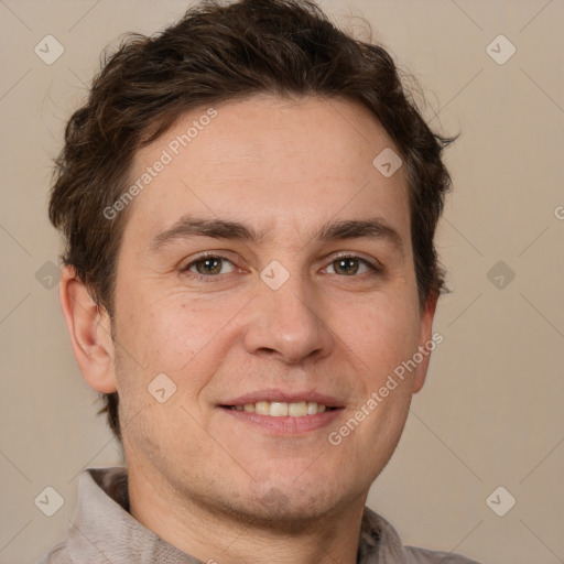 Joyful white adult male with short  brown hair and grey eyes