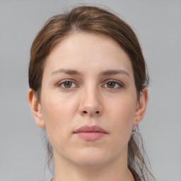 Neutral white young-adult female with short  brown hair and grey eyes