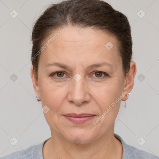 Joyful white adult female with short  brown hair and grey eyes