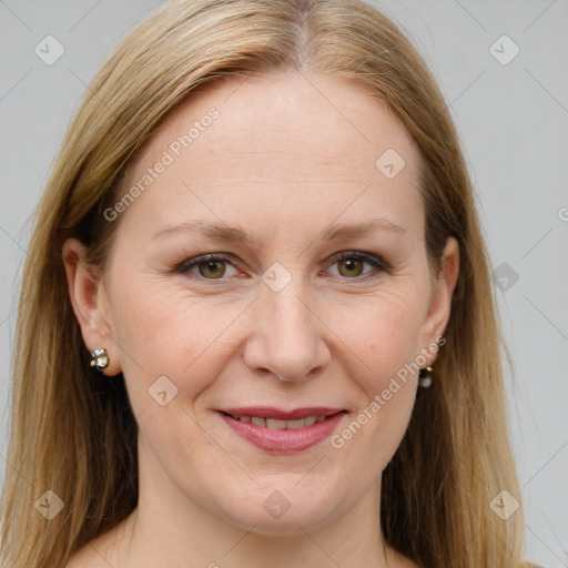 Joyful white adult female with long  brown hair and grey eyes