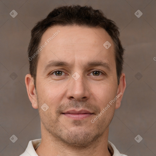 Joyful white adult male with short  brown hair and brown eyes