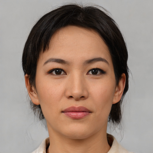 Neutral asian young-adult female with medium  brown hair and brown eyes