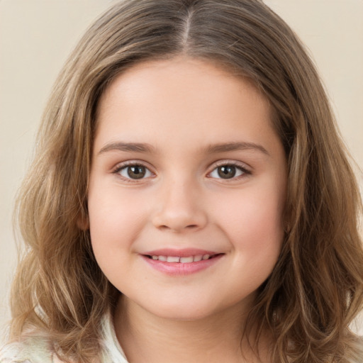 Joyful white child female with long  brown hair and brown eyes