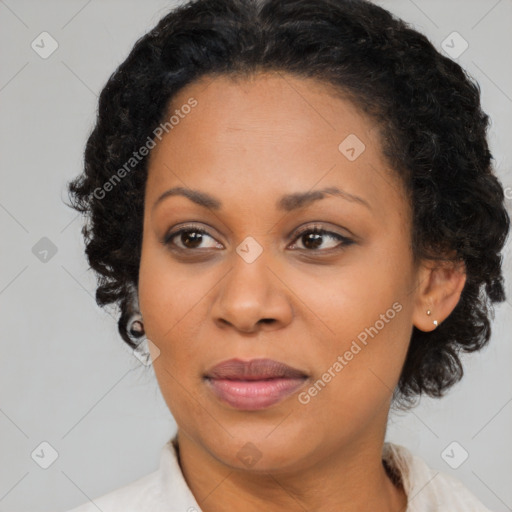 Joyful black adult female with medium  brown hair and brown eyes