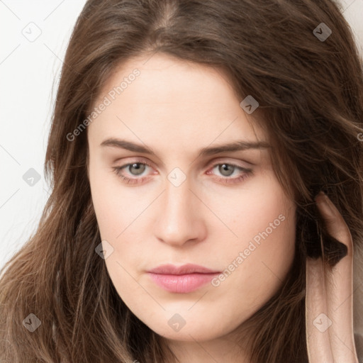 Neutral white young-adult female with long  brown hair and brown eyes