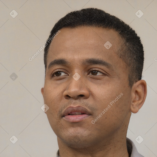 Neutral black young-adult male with short  black hair and brown eyes