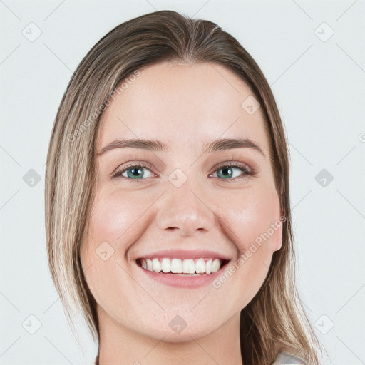 Joyful white young-adult female with long  brown hair and green eyes