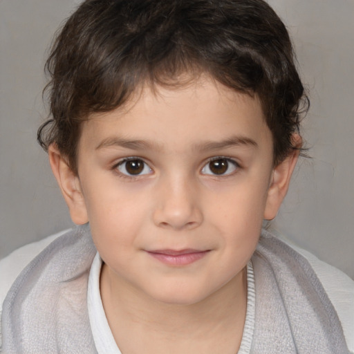 Joyful white child male with short  brown hair and brown eyes