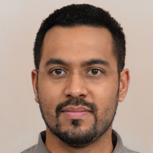 Neutral latino young-adult male with short  black hair and brown eyes