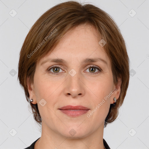 Joyful white adult female with medium  brown hair and grey eyes