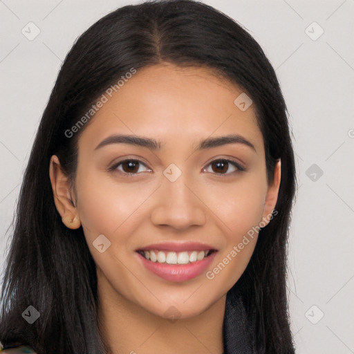 Joyful latino young-adult female with long  brown hair and brown eyes