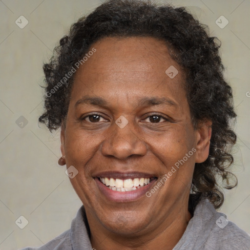 Joyful black adult female with short  brown hair and brown eyes