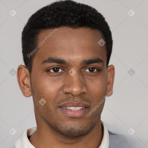 Joyful black young-adult male with short  brown hair and brown eyes