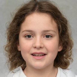 Joyful white child female with medium  brown hair and brown eyes