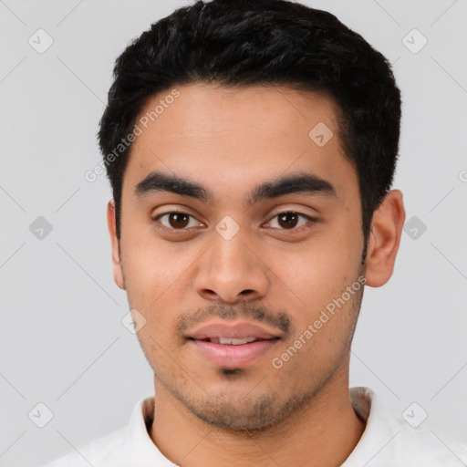 Joyful latino young-adult male with short  black hair and brown eyes