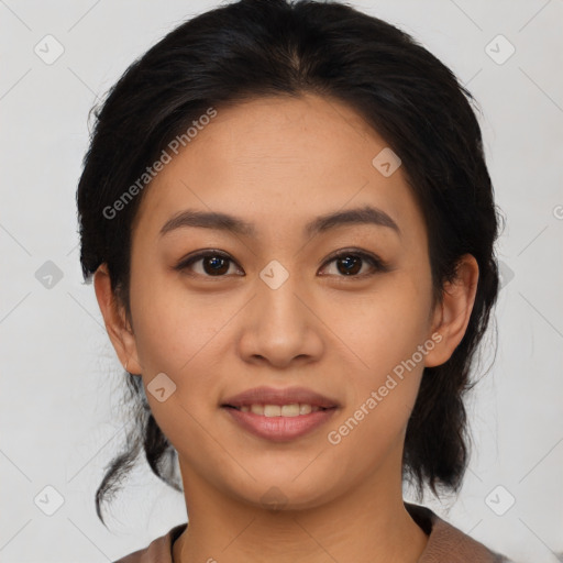 Joyful asian young-adult female with medium  black hair and brown eyes