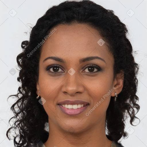 Joyful black young-adult female with long  brown hair and brown eyes