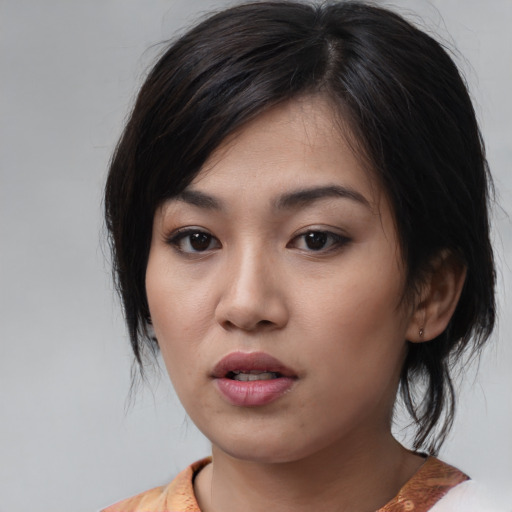 Neutral asian young-adult female with medium  black hair and brown eyes