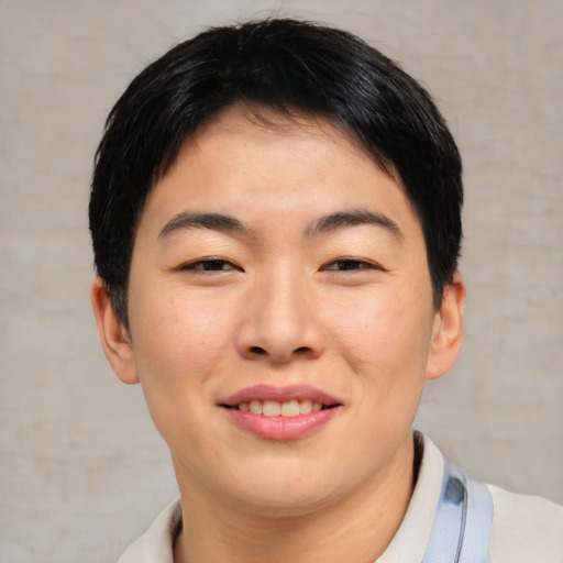 Joyful asian young-adult female with short  brown hair and brown eyes