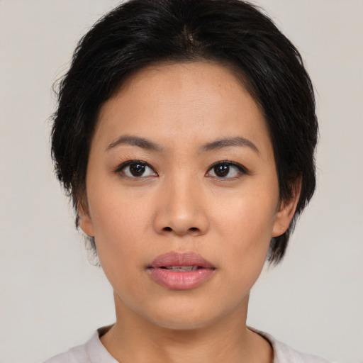 Neutral asian young-adult female with medium  black hair and brown eyes