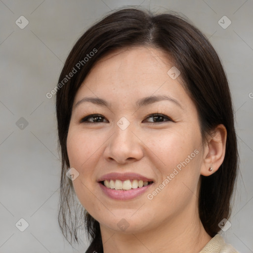 Joyful asian young-adult female with medium  brown hair and brown eyes