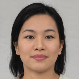 Joyful asian young-adult female with medium  brown hair and brown eyes