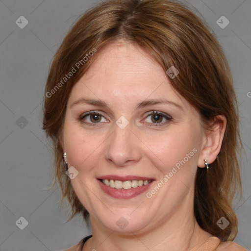 Joyful white adult female with medium  brown hair and brown eyes