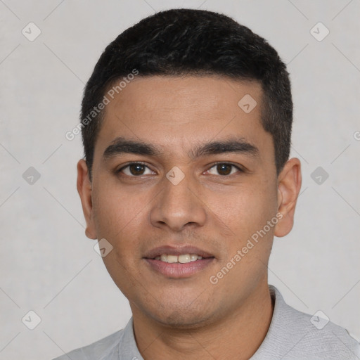 Joyful latino young-adult male with short  black hair and brown eyes