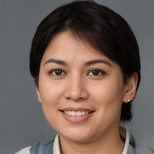 Joyful white young-adult female with medium  brown hair and brown eyes