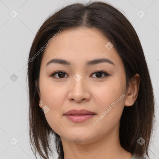 Joyful asian young-adult female with medium  brown hair and brown eyes