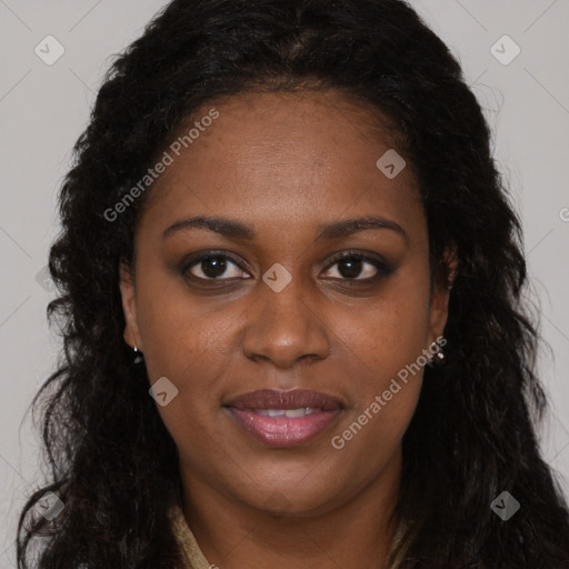 Joyful black adult female with long  brown hair and brown eyes