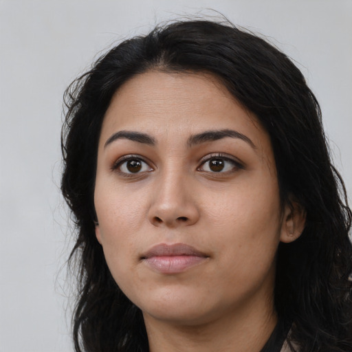 Neutral latino young-adult female with long  black hair and brown eyes