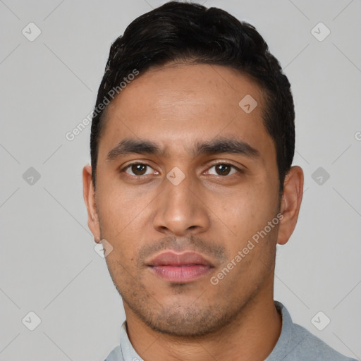 Neutral latino young-adult male with short  black hair and brown eyes