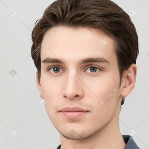 Neutral white young-adult male with short  brown hair and grey eyes