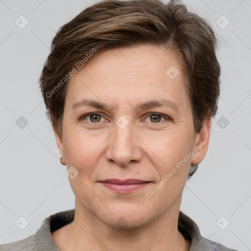 Joyful white adult female with short  brown hair and grey eyes