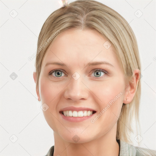 Joyful white young-adult female with medium  brown hair and blue eyes