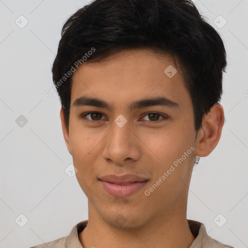 Joyful latino young-adult male with short  brown hair and brown eyes