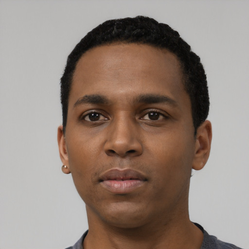 Neutral black young-adult male with short  black hair and brown eyes