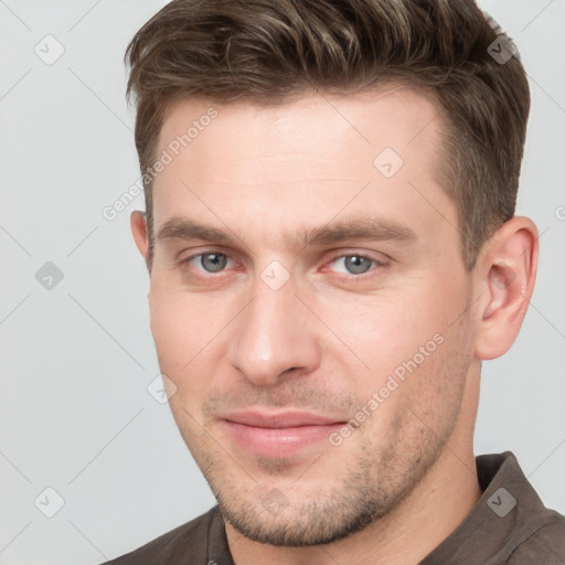 Neutral white young-adult male with short  brown hair and grey eyes