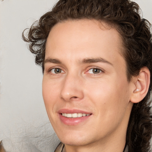 Joyful white young-adult male with medium  brown hair and brown eyes