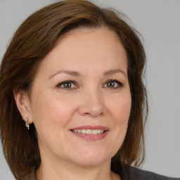 Joyful white adult female with medium  brown hair and brown eyes