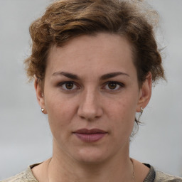 Joyful white adult female with short  brown hair and brown eyes