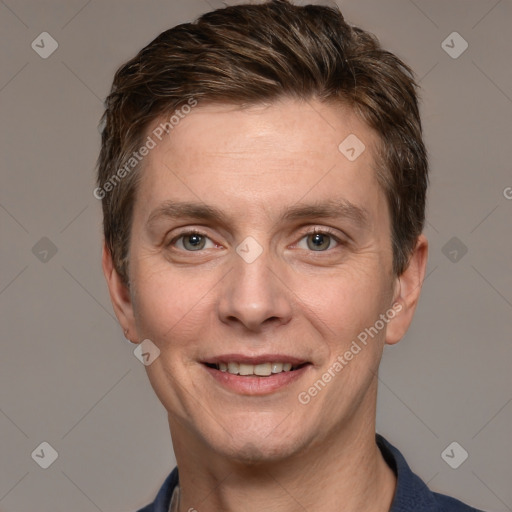 Joyful white adult male with short  brown hair and grey eyes