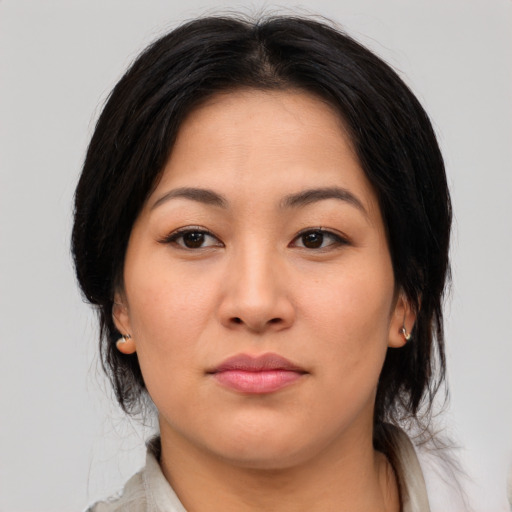 Neutral asian young-adult female with medium  brown hair and brown eyes
