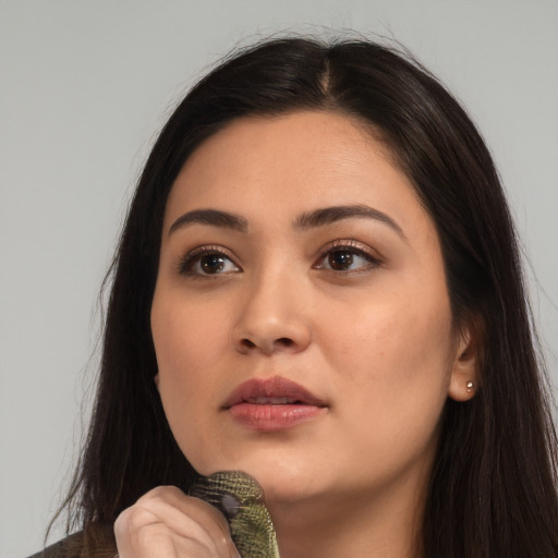 Neutral latino young-adult female with long  brown hair and brown eyes