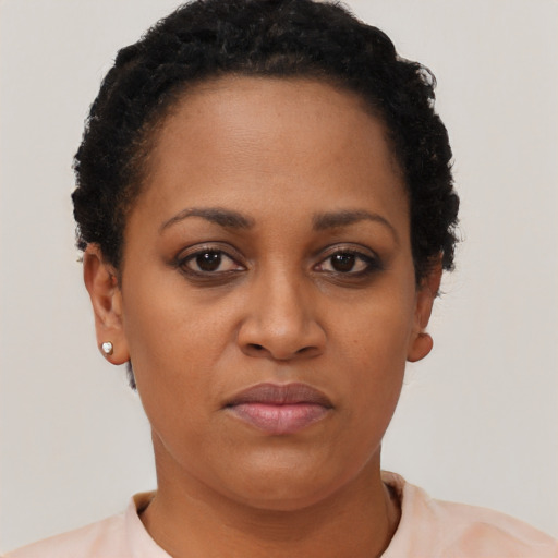 Neutral black young-adult female with short  black hair and brown eyes